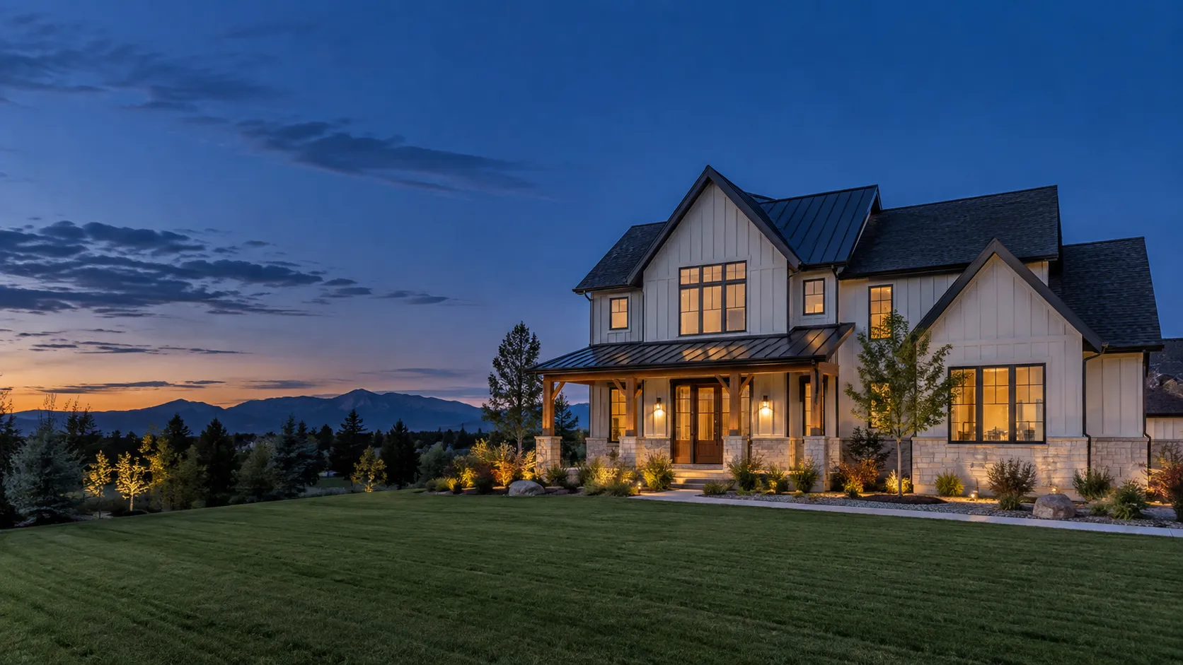 Colorado family home at dusk under a solid new roof with warm lights inside